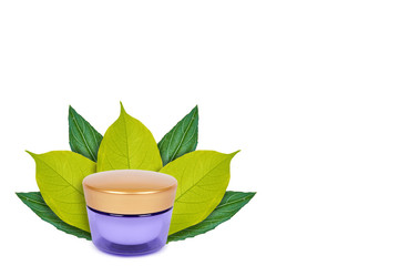 blank packaging cosmetic cream pot on the background of green leaves. Isolated on white. concept of natural origin