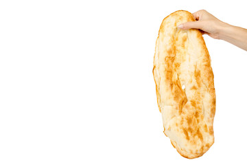 Hand with golden Pitta bread, eastern food culture