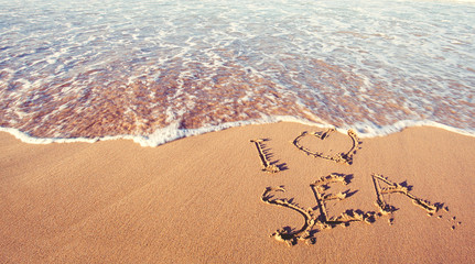 Happy holidays and travel concept. Sea beach and hand drawing text I love sea