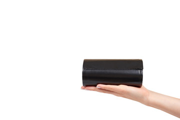 hand with roll of black plastic garbage bags for trash
