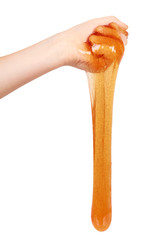 kid playing orange slime with hand, transparent toy