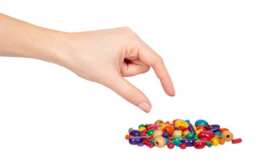 Hand with colored wooden beads, decorative accessory for hand made.