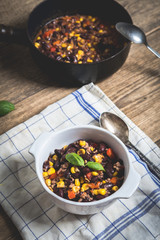 Chili corn carne on wood table