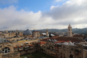 Fototapeta na wymiar Sky over Jerusalem old town. View on the Jerusalem old town from the rooftop in the early morning