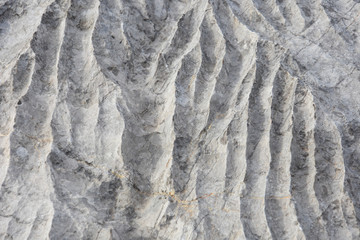 Rock formation in Sicevo gorge. Stone background, strange waves in the rock