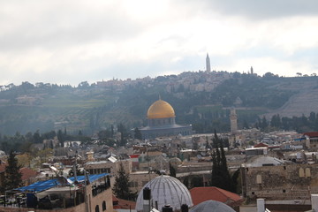 Naklejka premium Sky over Jerusalem old town. View on the Jerusalem old town from the rooftop in the early morning