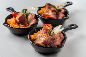 Duck breast with mango chutney in small pans