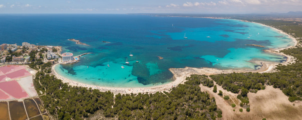 Colonia Sant Jordi, Spain. Amazing drone aerial landscape of the charming beaches Estanys and Es Trencs. Turquoise caribbean sea