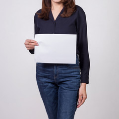 Business woman showing  blank white paper.