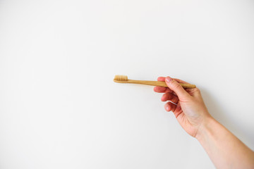 Wooden brush in woman hand