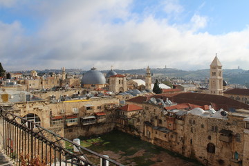 Fototapeta premium Sky over Jerusalem old town. View on the Jerusalem old town from the rooftop in the early morning