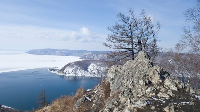 View of the source of the Angara river from lake Baikal from the observation deck at the stone Chersky. A journey to Siberia for the winter Baikal. Holidays in Russia