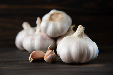 Garlic bulb on the wooden vintage background