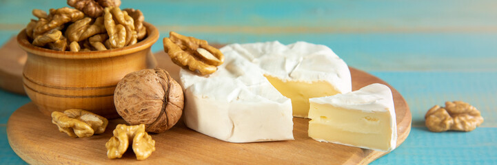 Cheese camembert or brie with walnut kernels