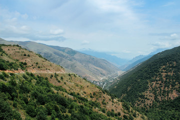 Fototapeta na wymiar Dangerous road in the mountains of Armenia and a big valley