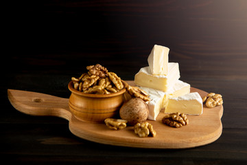 Cheese camembert or brie with walnut kernels