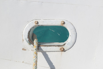 Hawse with ropes in white ship hull