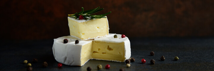 Cheese camembert or brie with fresh rosemary