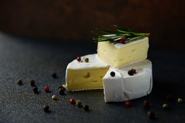 Cheese camembert or brie with fresh rosemary
