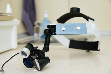 A dentist treats a patient's child in a dental office in a pleasant environment.Dentist, Child, Dental Hygiene.glasses for the dentist