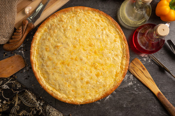Pizza of four sorts of cheese for a restaurant menu.