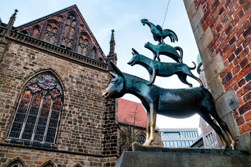 A bronze statue depicting the Bremen Town Musicians in Bremen, Germany. March 2019 - obrazy, fototapety, plakaty