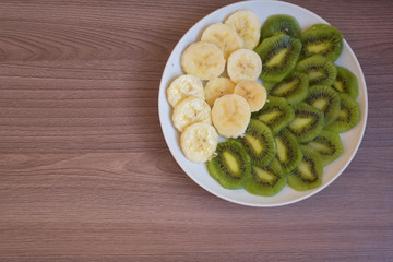 Cutting fruit on a platter.