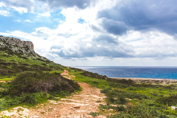 Fototapeta na wymiar Beautiful valley by the sea. Trail leading along the coast. Seascape in Cyprus Ayia Napa