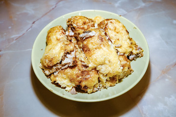 the fried fish fillet in batter in a pan