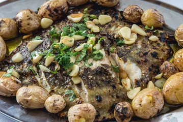 Plate of grilled fish with potatoes in Portugal