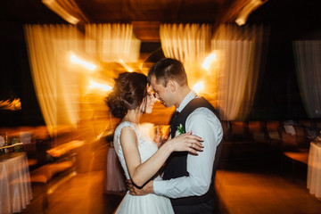 Luxury dance of the bride and groom in motion. Long exposure