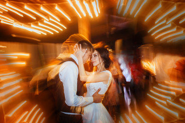 Luxury dance of the bride and groom in motion. Long exposure
