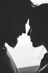 Close portrait of a young couple. Man and woman in love. Cling to each other.