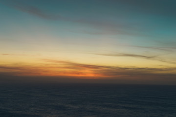 Naklejka na ściany i meble sunset over the sea. Blurred background