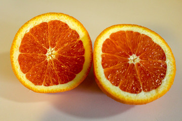 Orange halves. Cross section close up on white background