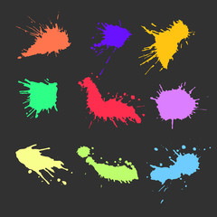 Colorful ink paint spots. Drops texture isolated on dark background. Set for grunge splash textures. Vector illustration