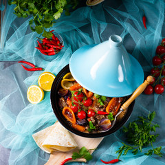 Tasty spicy beef with various vegetables cooked in tagine