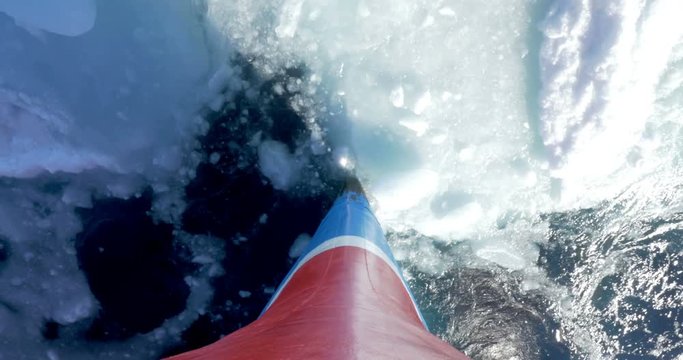 Ship breaks ice in the sea of Spitsbergen Norway Beautiful Prow of a ship shot of large ship sail and break the ice Prow of a ship 