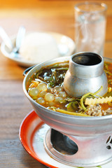 Thai tradition food: Kaeng Som is Thai sour soup with egg fish and vegetables. Served with tamarind soup in hot pot. Famous food of Thailand. Shoot in studio, Clean food good taste concept.