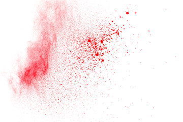 Abstract red dust explosion on white background. Freeze motion of red powder splash.