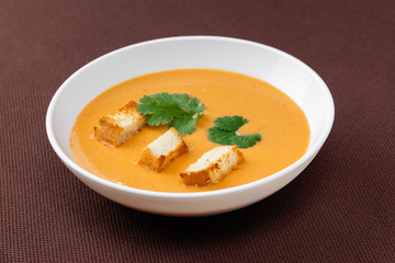 cream soup with crackers and herbs