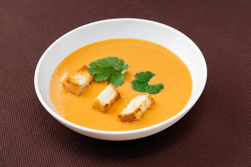 cream soup with crackers and herbs