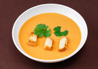 cream soup with crackers and herbs