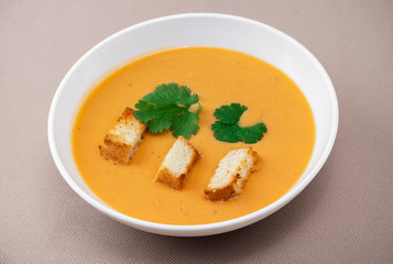 cream soup with crackers and herbs