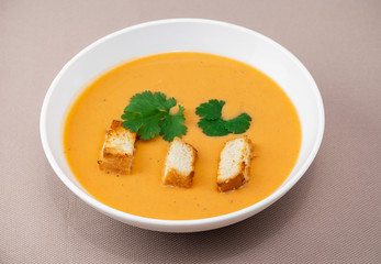 cream soup with crackers and herbs