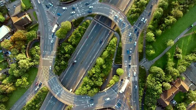 car roundabout aerial view with busy road