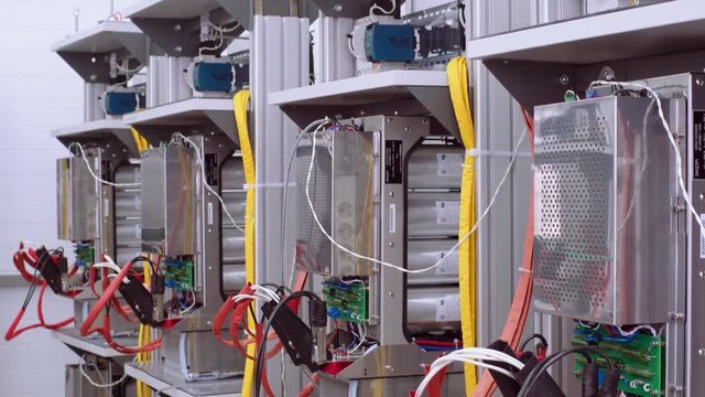 Test benches in the laboratory for the production of microprocessor-based protection and automation devices. Wires with clamp close up.