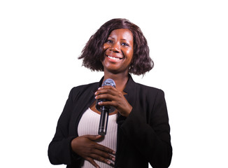  confident black African American business woman with microphone speaking in auditorium at...