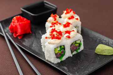 sushi on a black plate