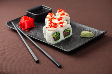 sushi on a black plate